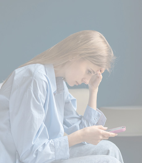 Woman-Looking-at-Phone_edited Woman-Looking-at-Phone_edited